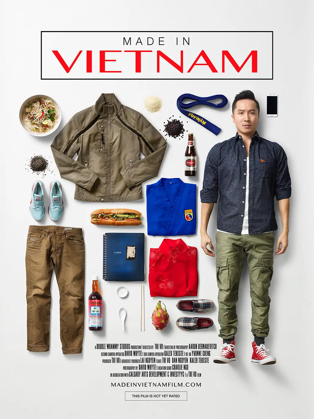 Made in Vietnam poster: a man stands beside a flat-lay of his belongings